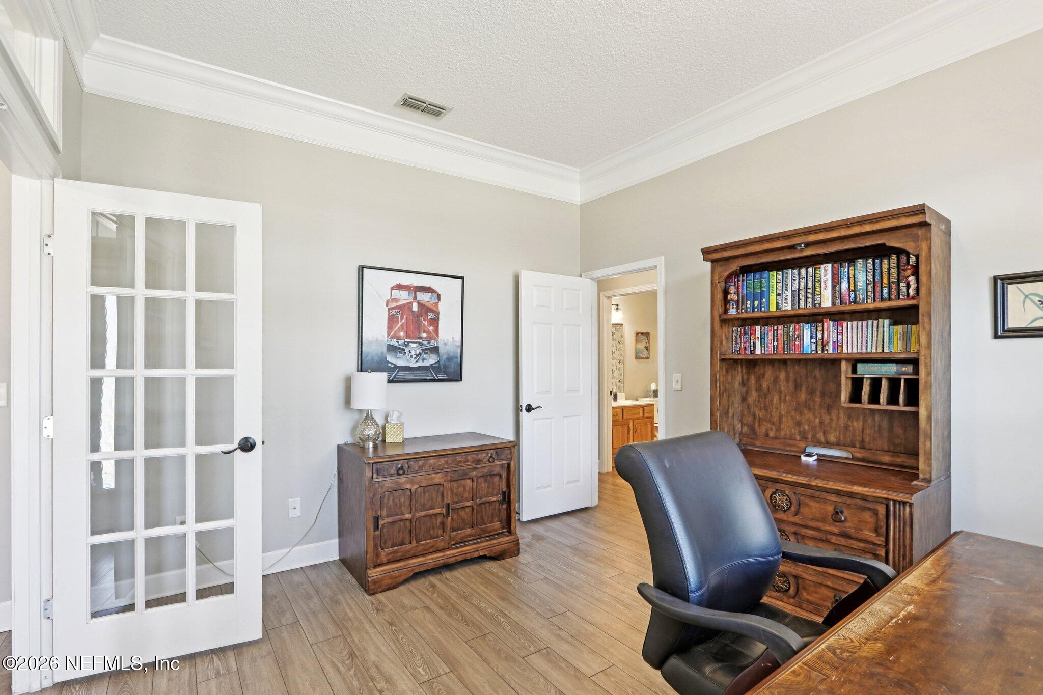 1405 Sinclair Lane Jacksonville, FL 32221 - Photo 25 of 37 a view of a workspace with furniture and wooden floor