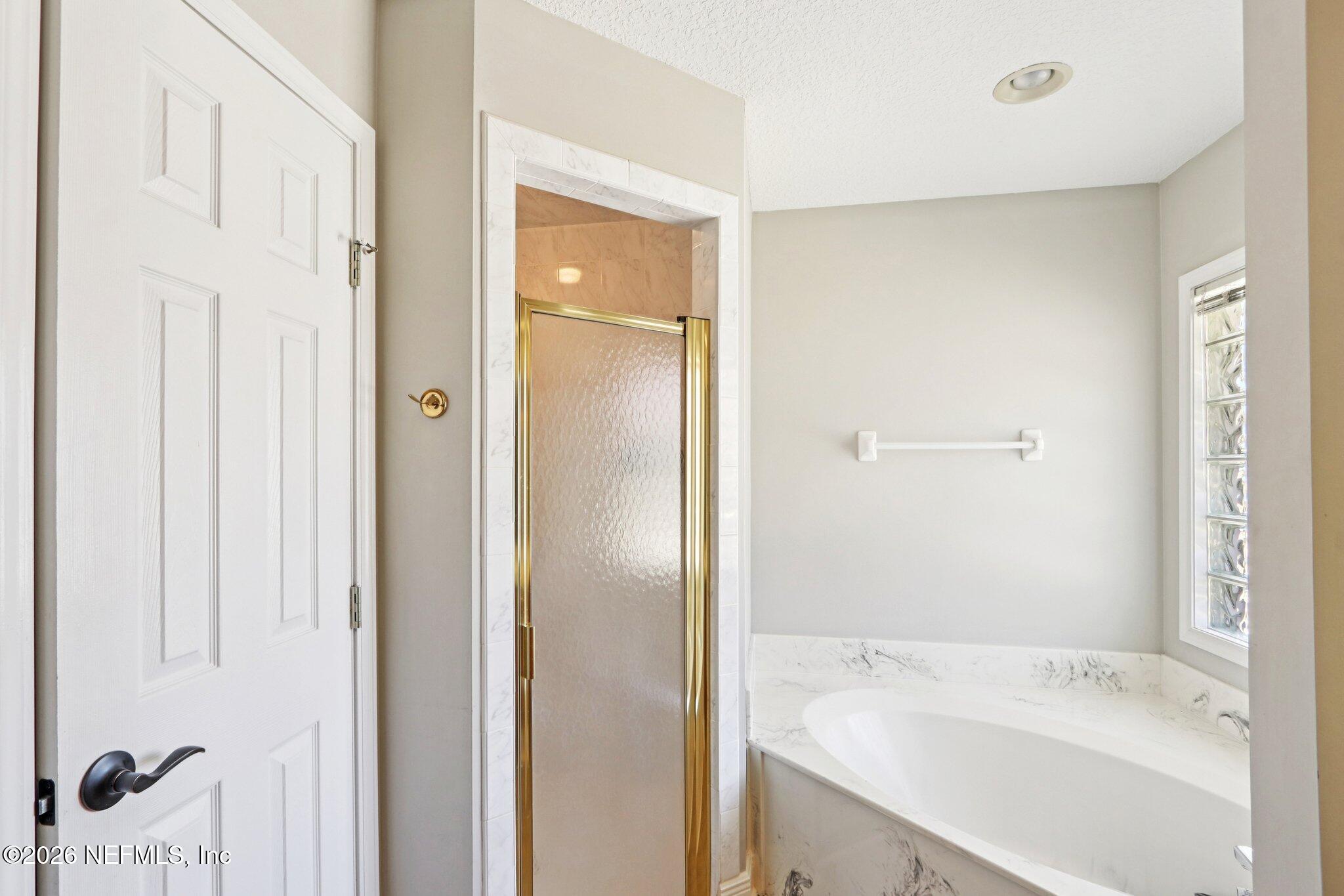1405 Sinclair Lane Jacksonville, FL 32221 - Photo 29 of 37 a bathroom with a tub sink and mirror