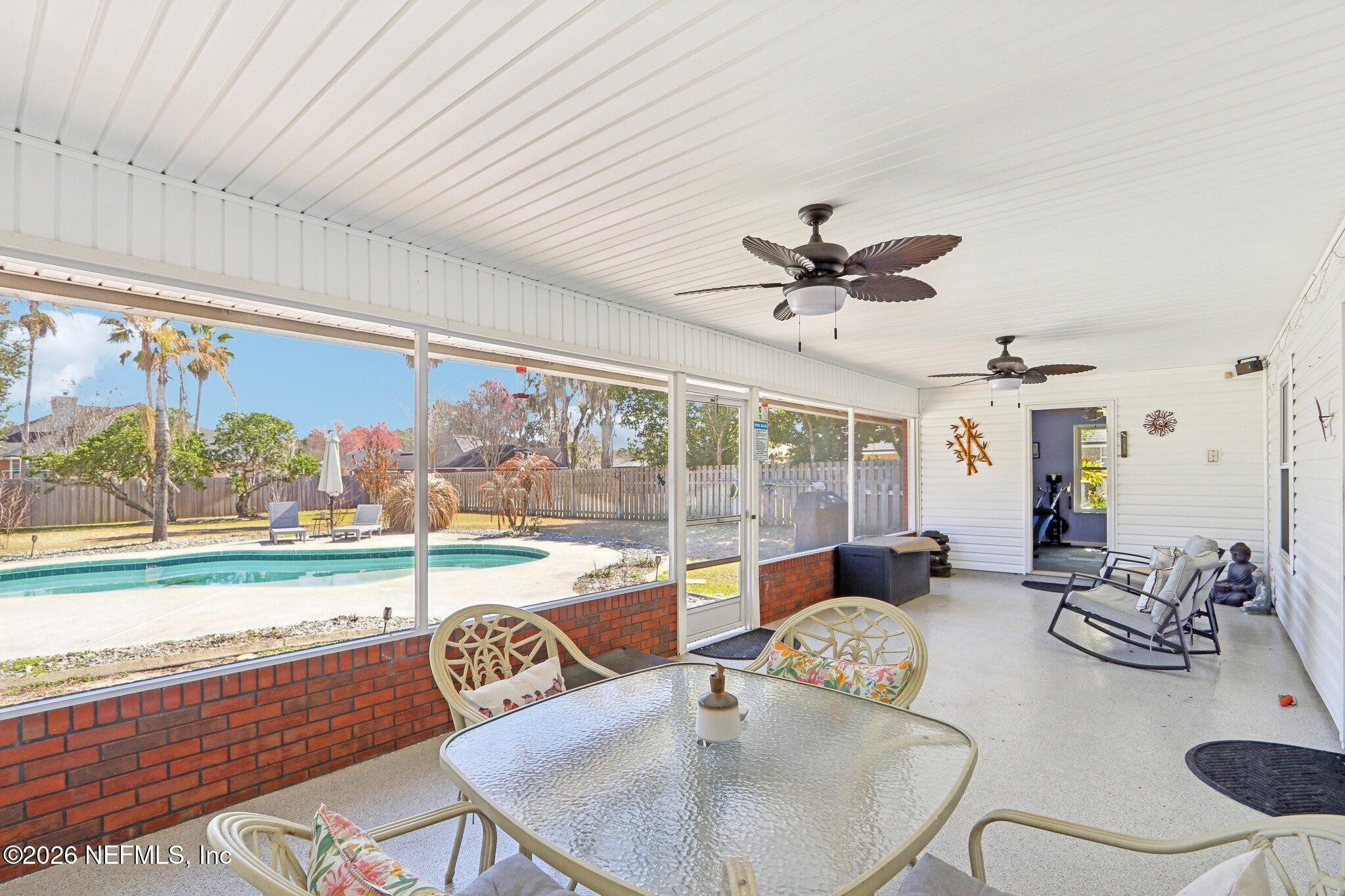 1405 Sinclair Lane Jacksonville, FL 32221 - Photo 32 of 37 a view of a dining room with furniture wooden floor and a chandelier