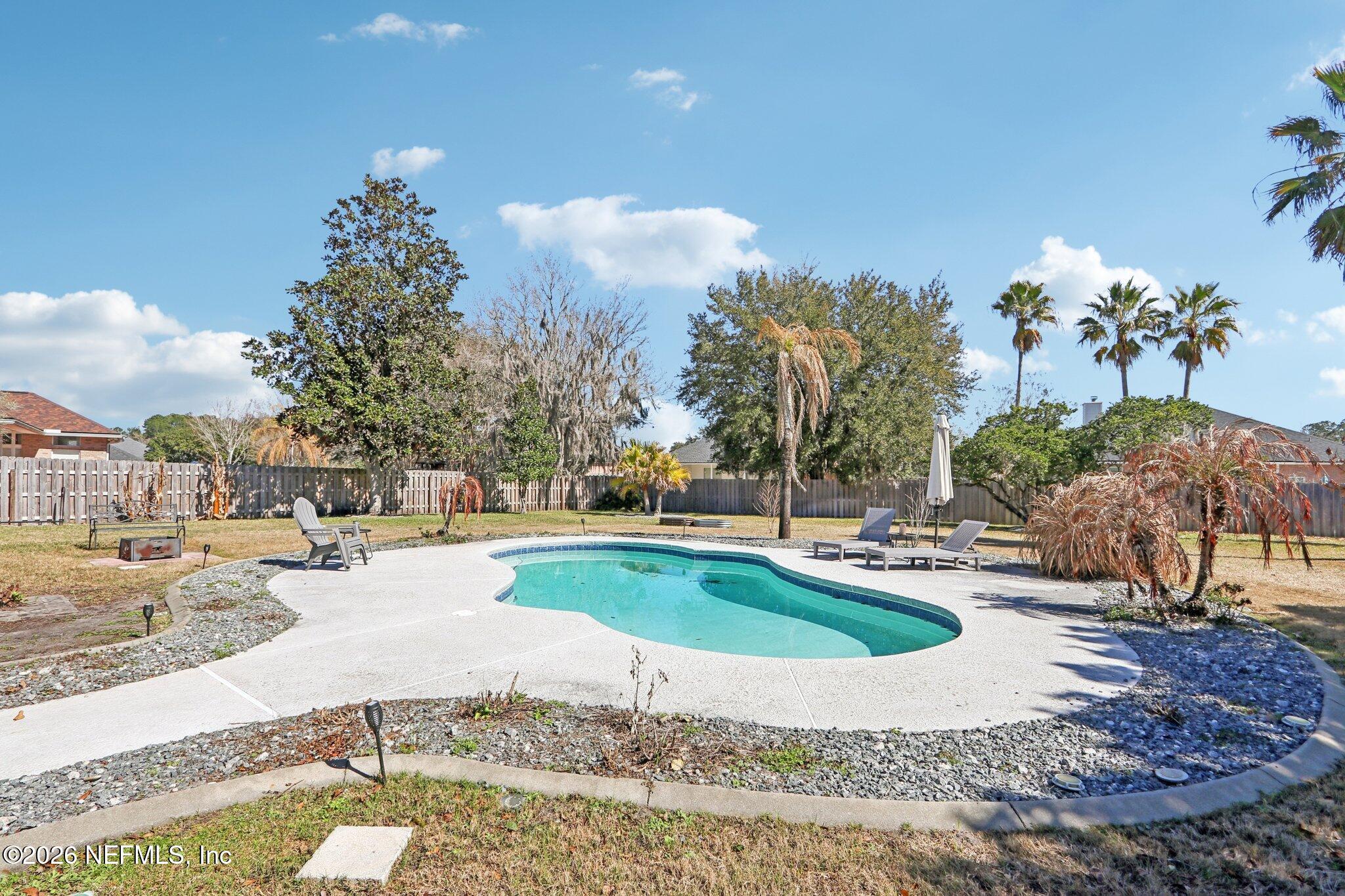 1405 Sinclair Lane Jacksonville, FL 32221 - Photo 35 of 37 a view of a house with swimming pool and sitting area