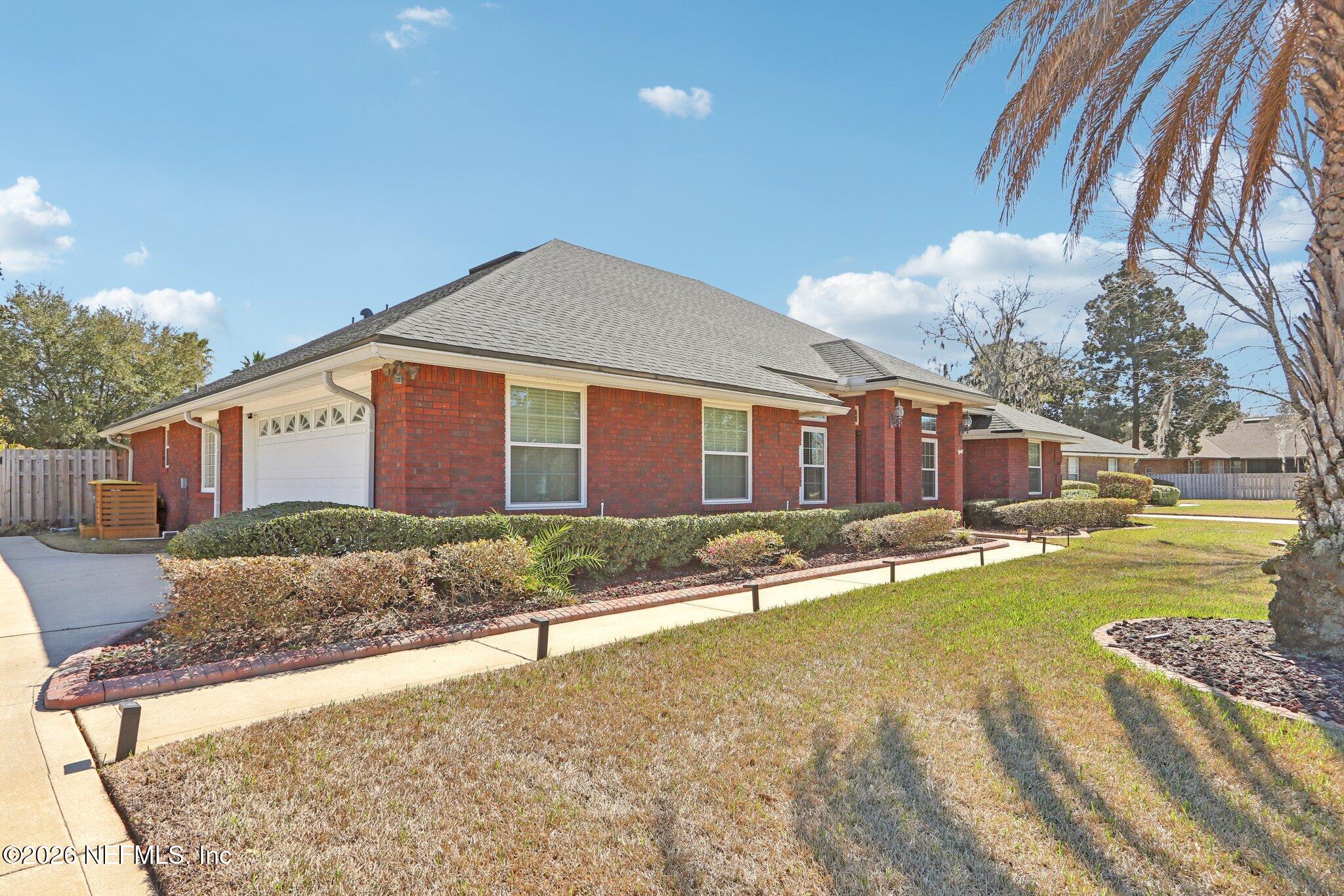 1405 Sinclair Lane Jacksonville, FL 32221 - Photo 37 of 37 a front view of a house with a yard and swimming pool