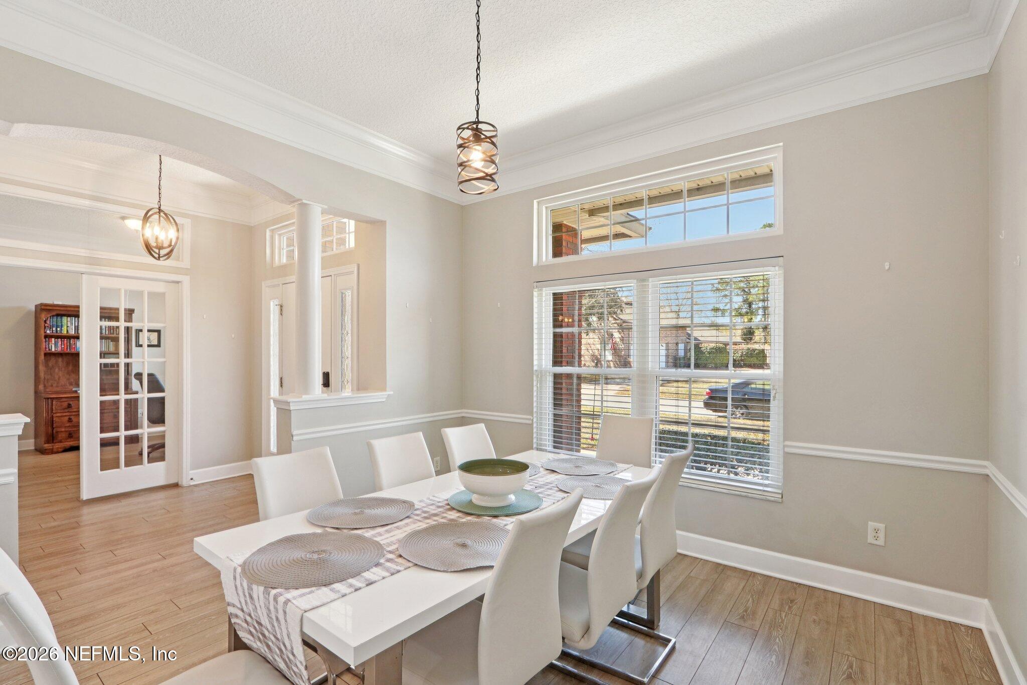 1405 Sinclair Lane Jacksonville, FL 32221 - Photo 10 of 37 a view of a dining room with furniture window and wooden floor