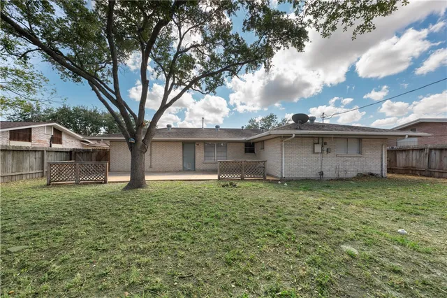 a house view with a garden space