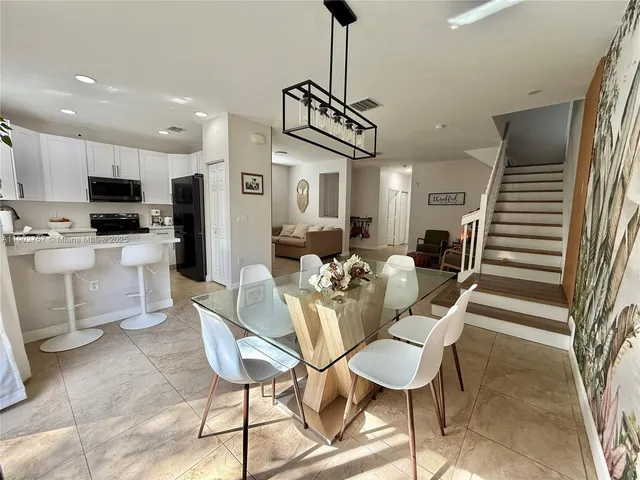 a view of a dining room with furniture