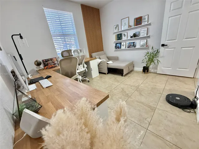 a bedroom with furniture and a book shelf