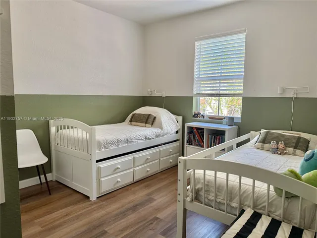 a bedroom with a bed and a table