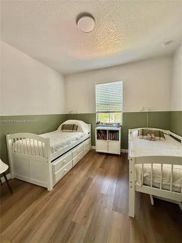 a bedroom with a bed and a table