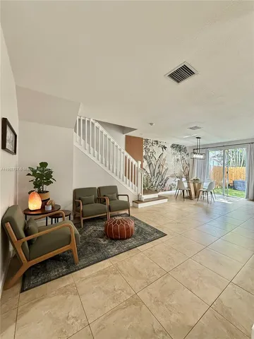 a living room with furniture and a table