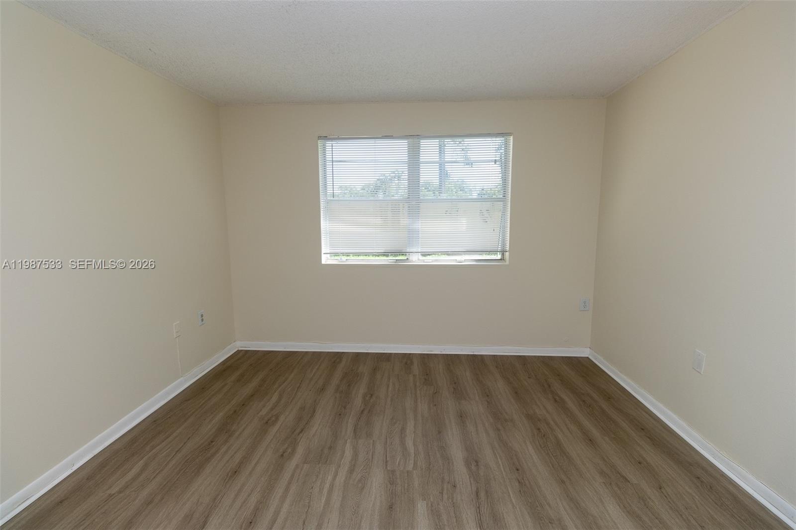 2157 Southwest 80th Terrace, Unit 2157 Miramar, FL 33025 - Photo 11 of 29 an empty room with a window