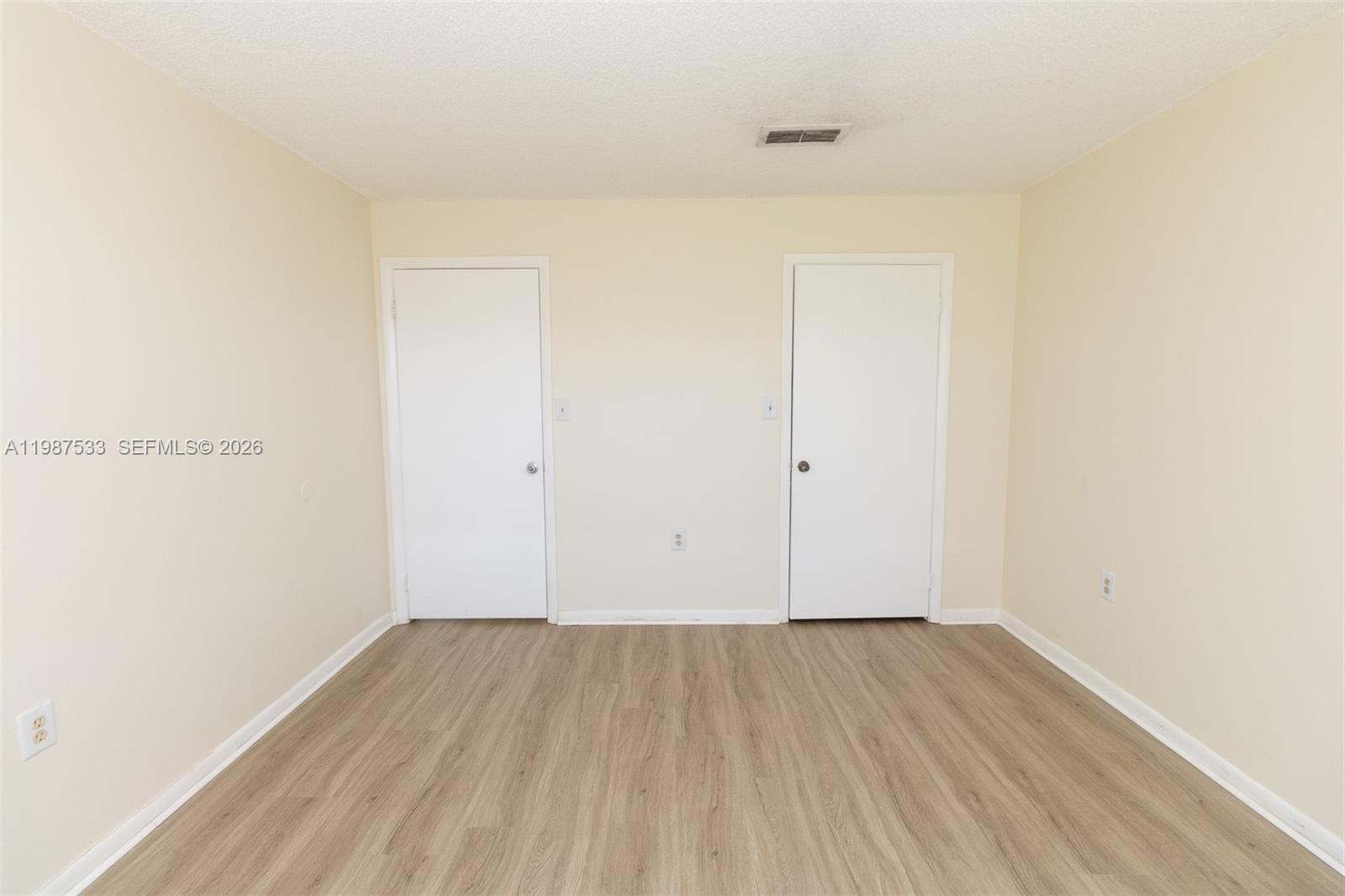 2157 Southwest 80th Terrace, Unit 2157 Miramar, FL 33025 - Photo 12 of 29 a view of a room with wooden floor