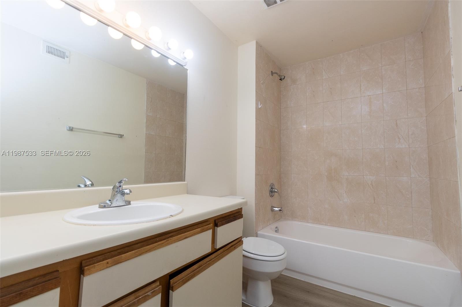 2157 Southwest 80th Terrace, Unit 2157 Miramar, FL 33025 - Photo 14 of 29 a bathroom with a sink a toilet and a bathtub