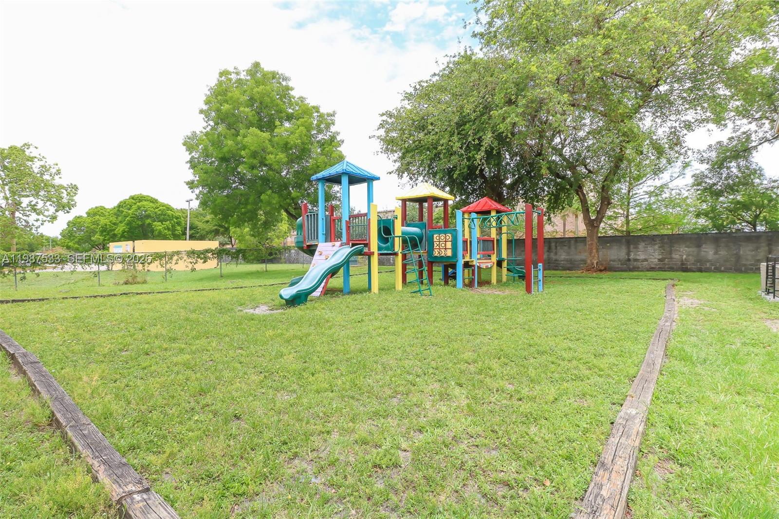 2157 Southwest 80th Terrace, Unit 2157 Miramar, FL 33025 - Photo 19 of 29 a view of a park with swings and slides