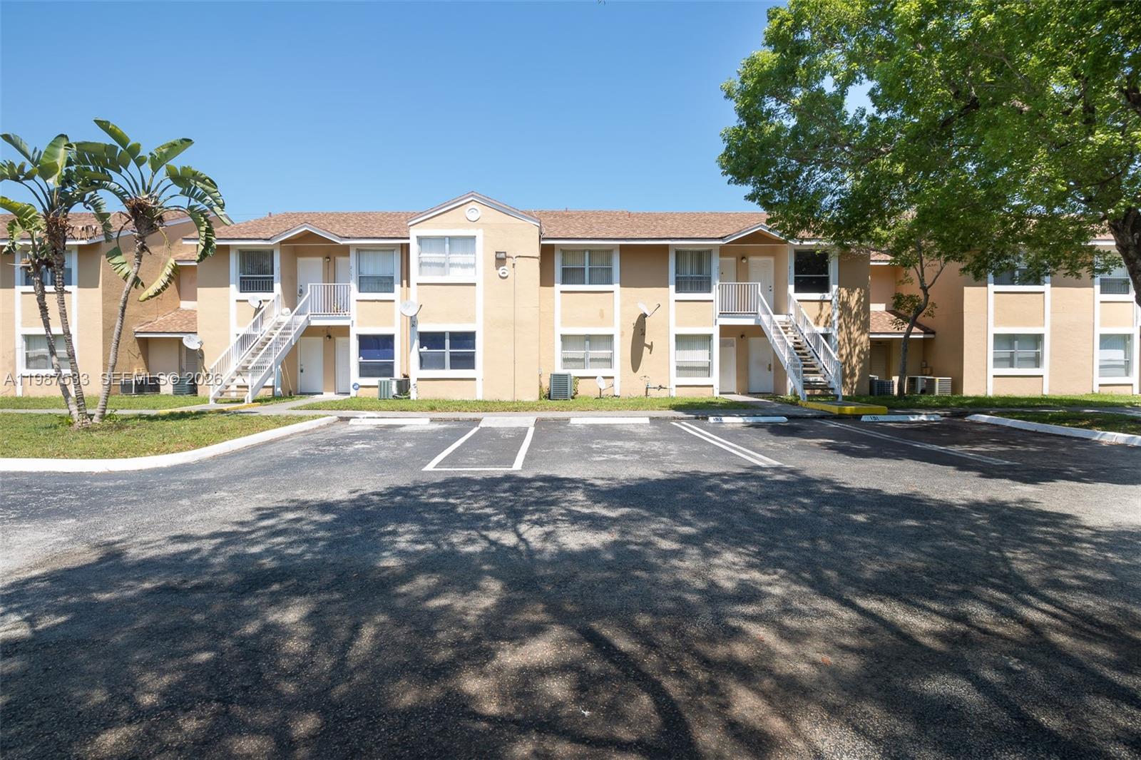 2157 Southwest 80th Terrace, Unit 2157 Miramar, FL 33025 - Photo 22 of 29 a front view of a building with a garden