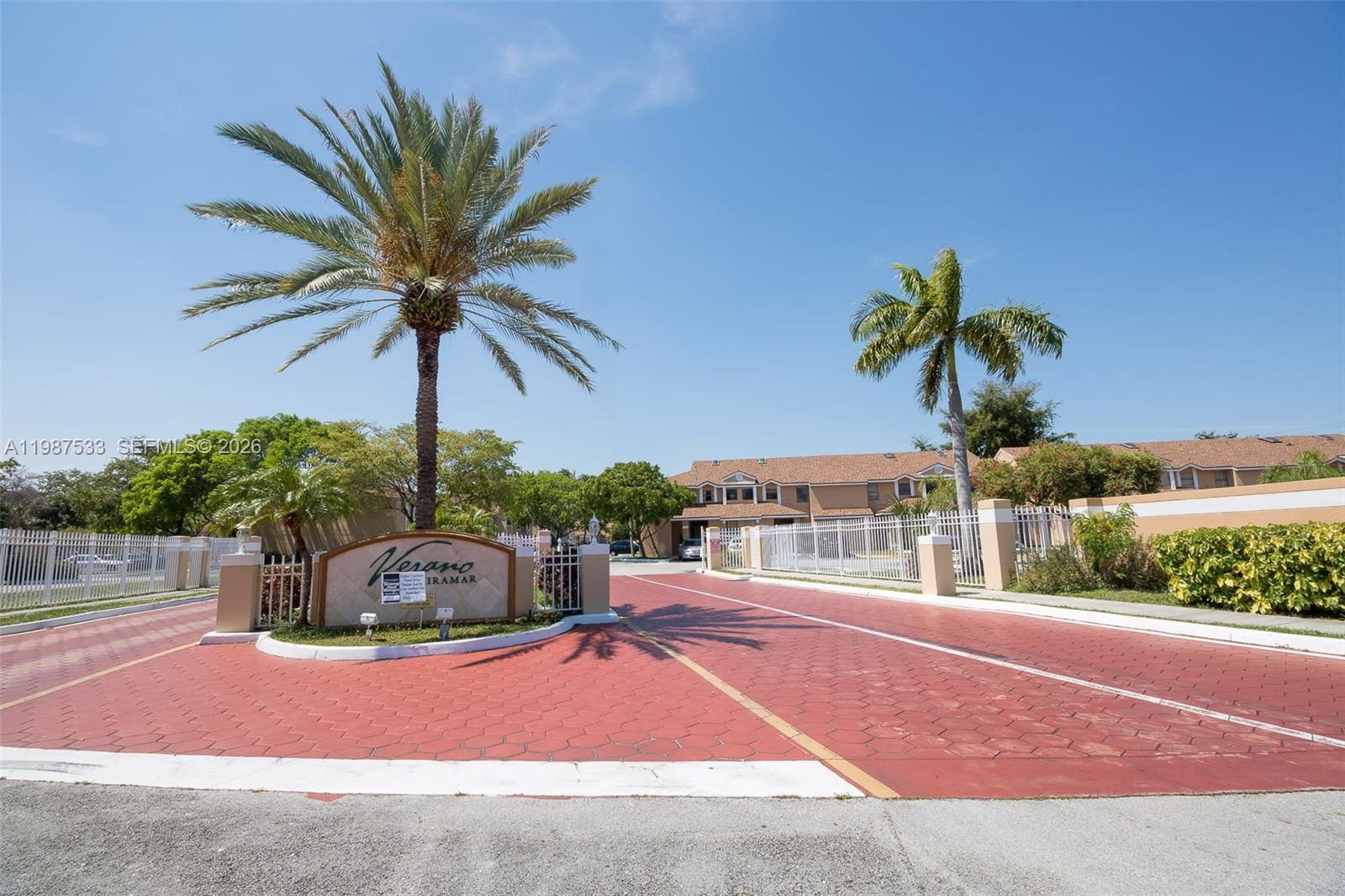 2157 Southwest 80th Terrace, Unit 2157 Miramar, FL 33025 - Photo 24 of 29 a swimming pool with an outdoor space and seating area