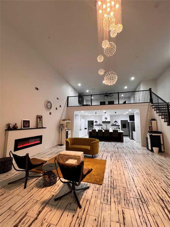 403 North Nash Street Kaufman, TX 75142 - Photo 11 of 18 a living room with furniture and a chandelier