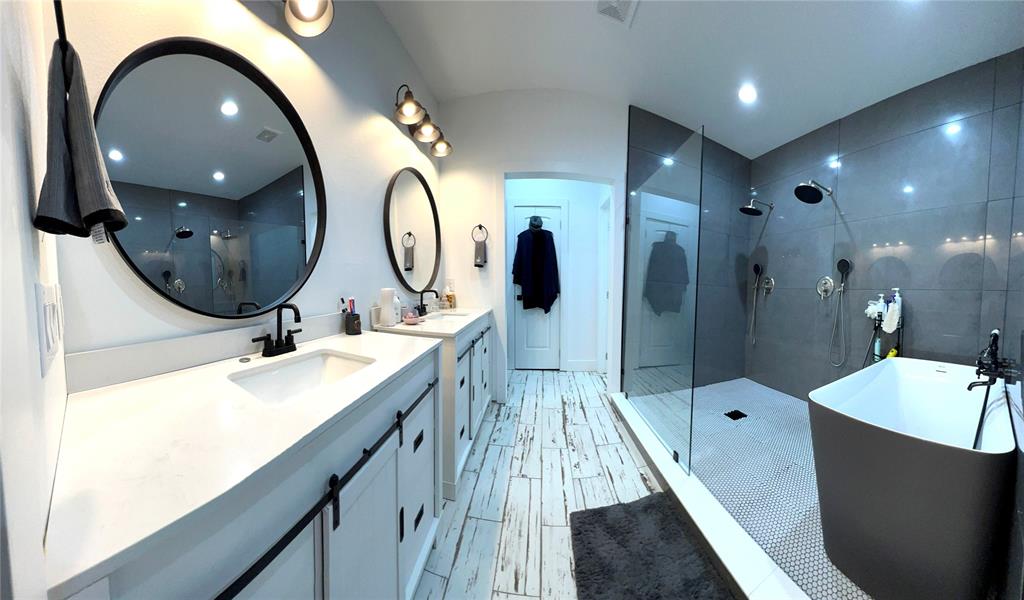403 North Nash Street Kaufman, TX 75142 - Photo 13 of 18 a bathroom with a sink double vanity and a mirror