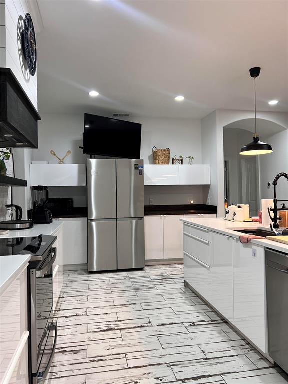 403 North Nash Street Kaufman, TX 75142 - Photo 5 of 18 a kitchen with a sink stainless steel appliances and cabinets