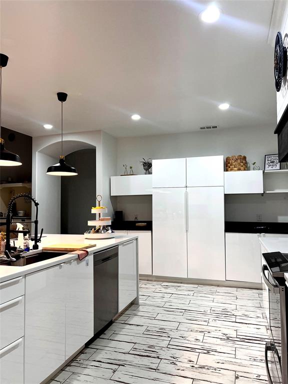 403 North Nash Street Kaufman, TX 75142 - Photo 6 of 18 a kitchen with a sink a stove and a microwave