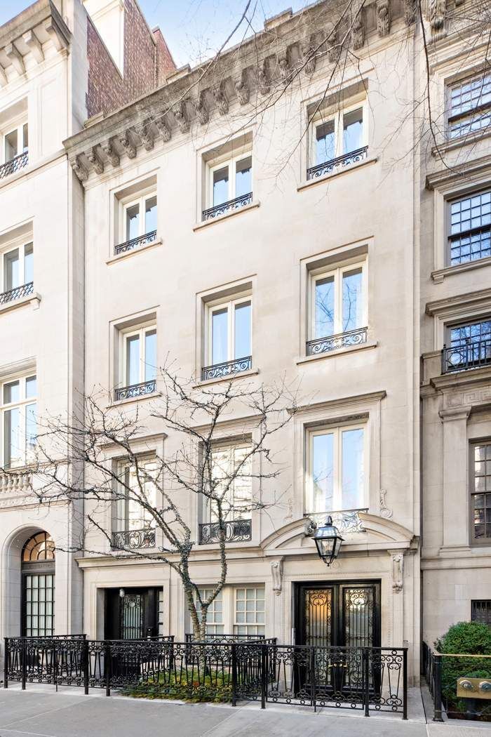 10 East 73rd Street Manhattan, NY 10021 - Photo 1 of 16 a front view of a building with many windows