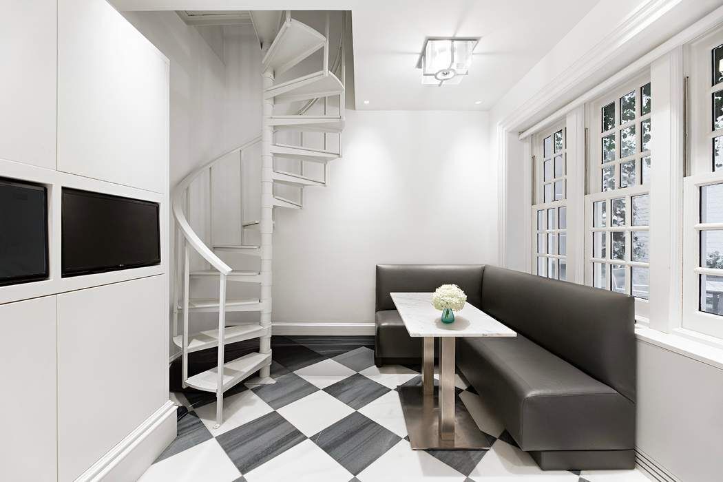 10 East 73rd Street Manhattan, NY 10021 - Photo 6 of 16 a living room with furniture and a rug