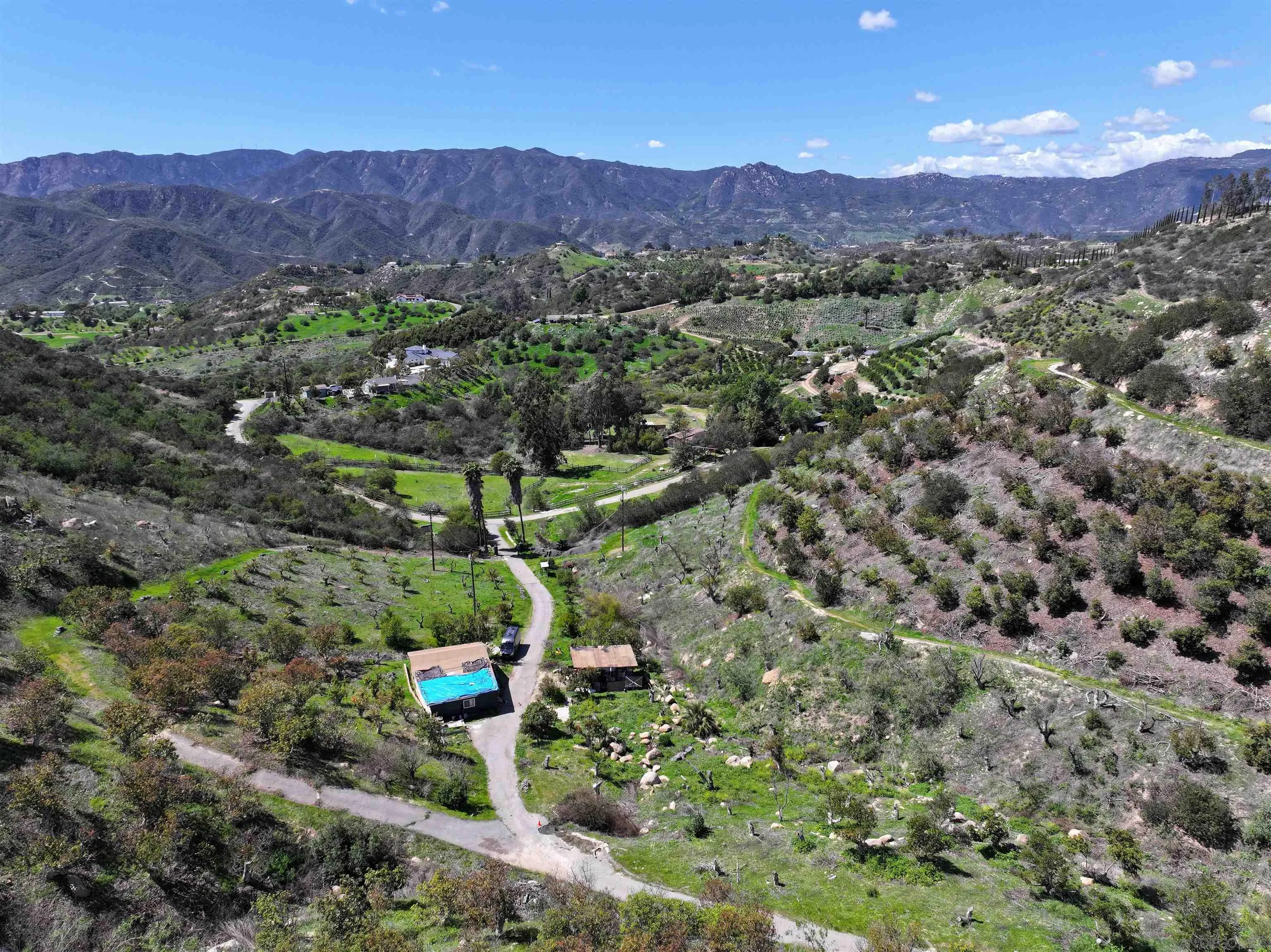 2339 Green Valley Road, Unit 2339 Fallbrook, CA 92028 - Photo 7 of 8 a view of a lush green hillside and houses