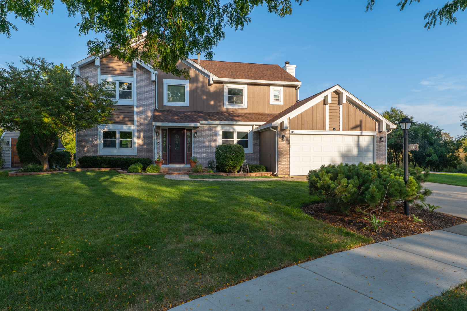 113 Bittersweet Lane Streamwood, IL 60107 - Photo 1 of 24 a front view of a house with a yard
