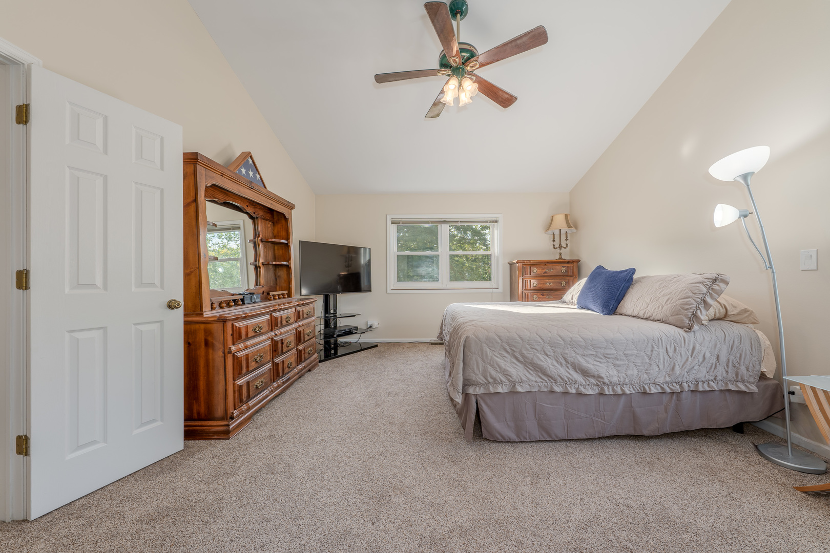 113 Bittersweet Lane Streamwood, IL 60107 - Photo 13 of 24 a spacious bedroom with a bed and a flat screen tv