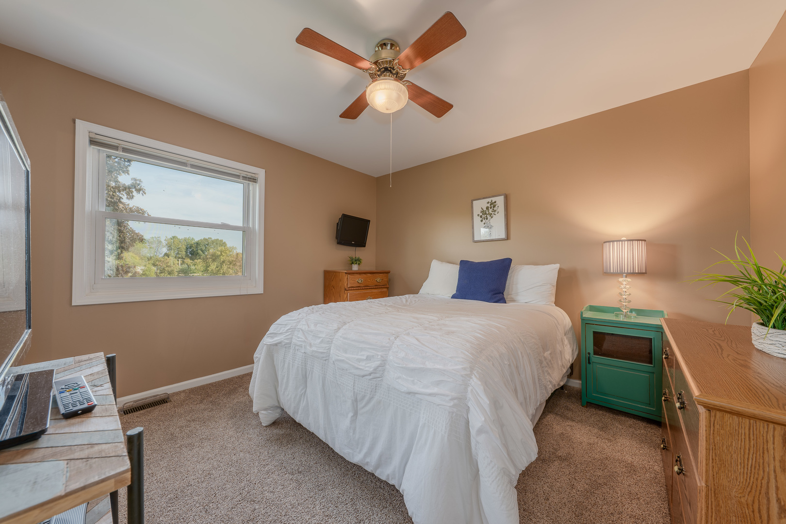 113 Bittersweet Lane Streamwood, IL 60107 - Photo 16 of 24 a bedroom with a bed and a painting on the wall