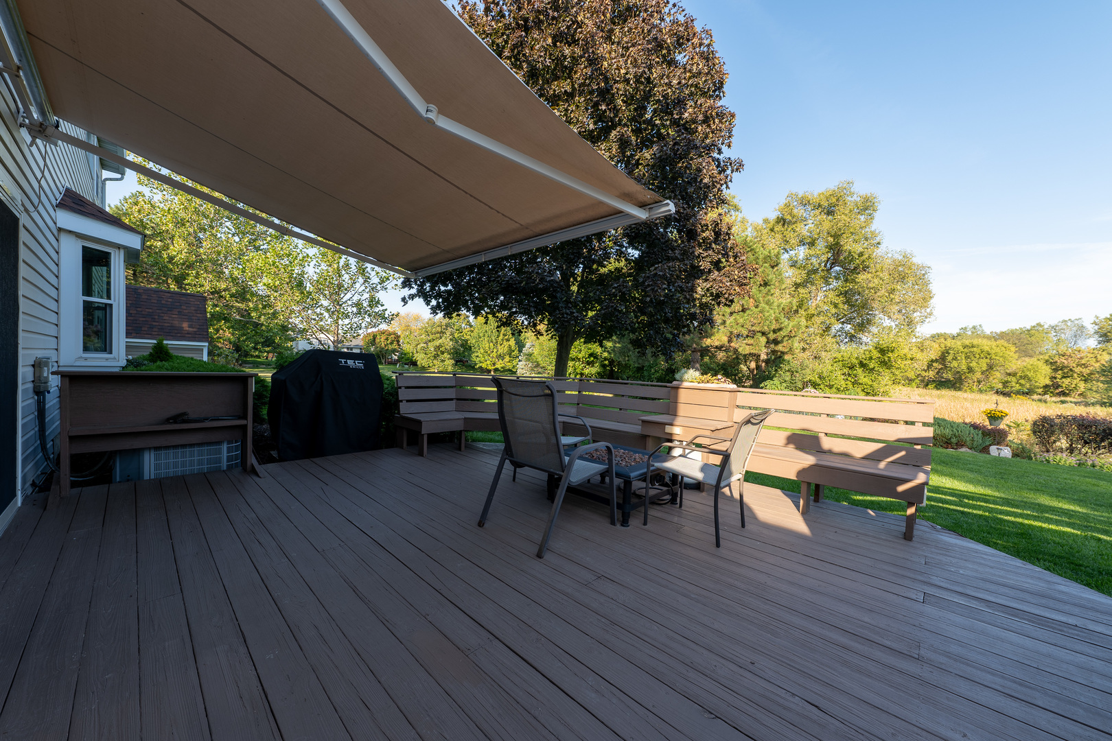 113 Bittersweet Lane Streamwood, IL 60107 - Photo 18 of 24 an outdoor sitting area with furniture and wooden floor