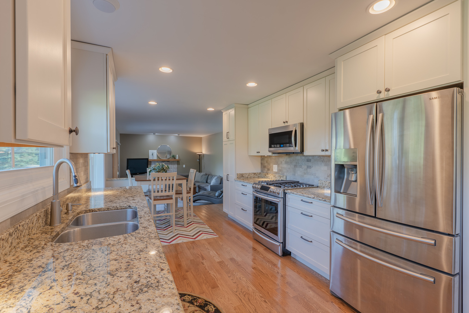 113 Bittersweet Lane Streamwood, IL 60107 - Photo 5 of 24 a kitchen with stainless steel appliances granite countertop a refrigerator stove microwave and sink
