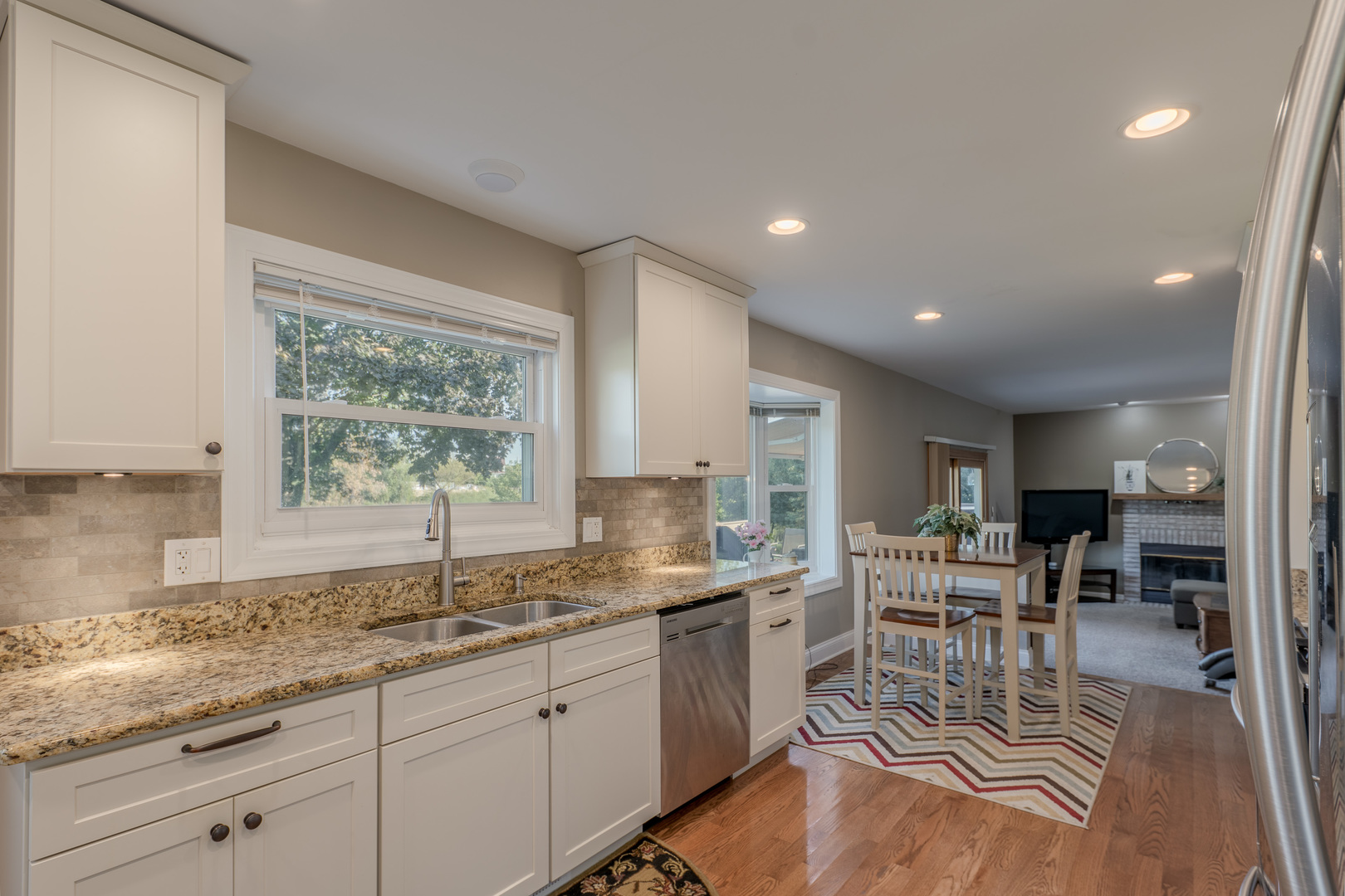 113 Bittersweet Lane Streamwood, IL 60107 - Photo 6 of 24 a kitchen with sink and view of living room