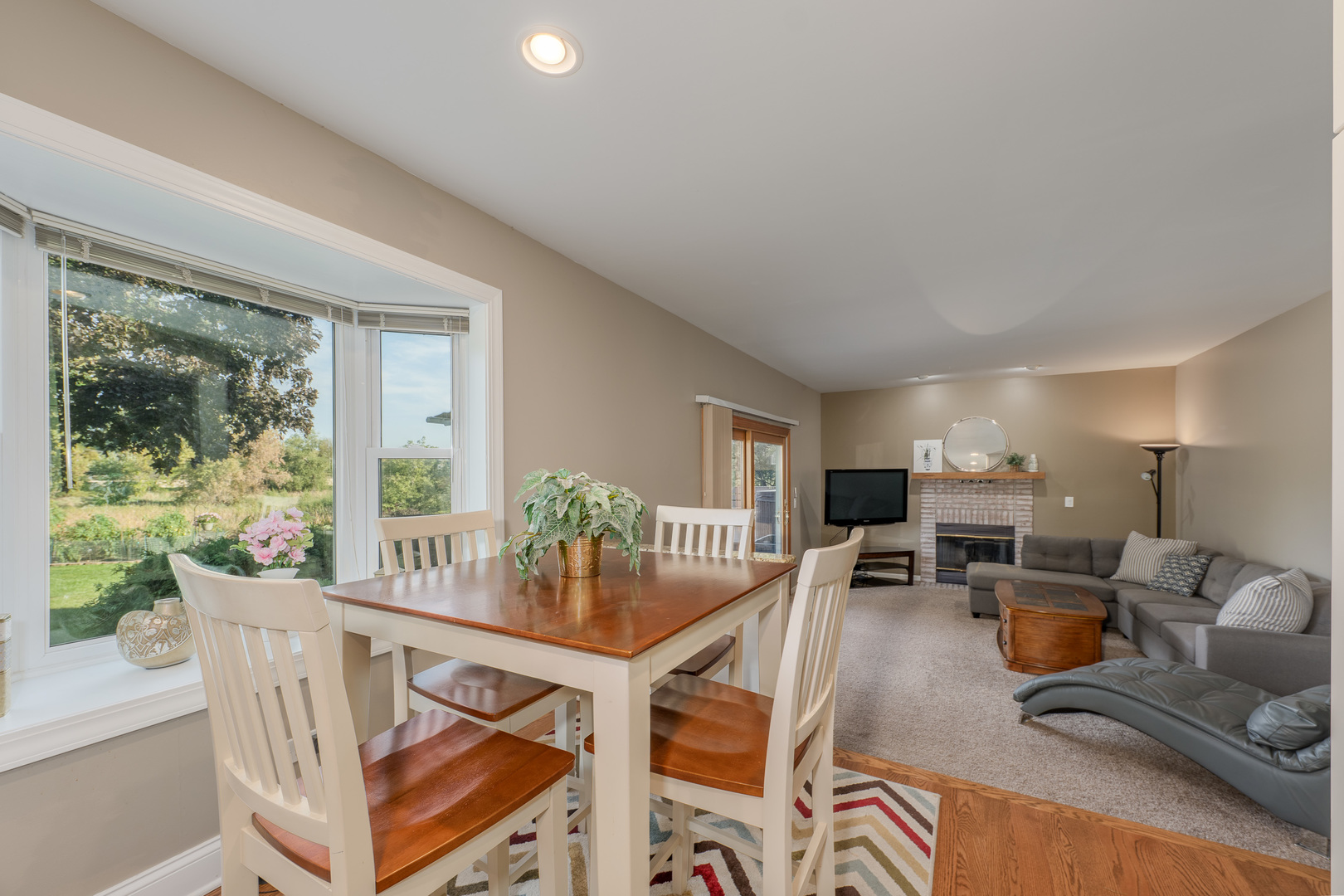 113 Bittersweet Lane Streamwood, IL 60107 - Photo 7 of 24 a view of a dining room with furniture window and outside view