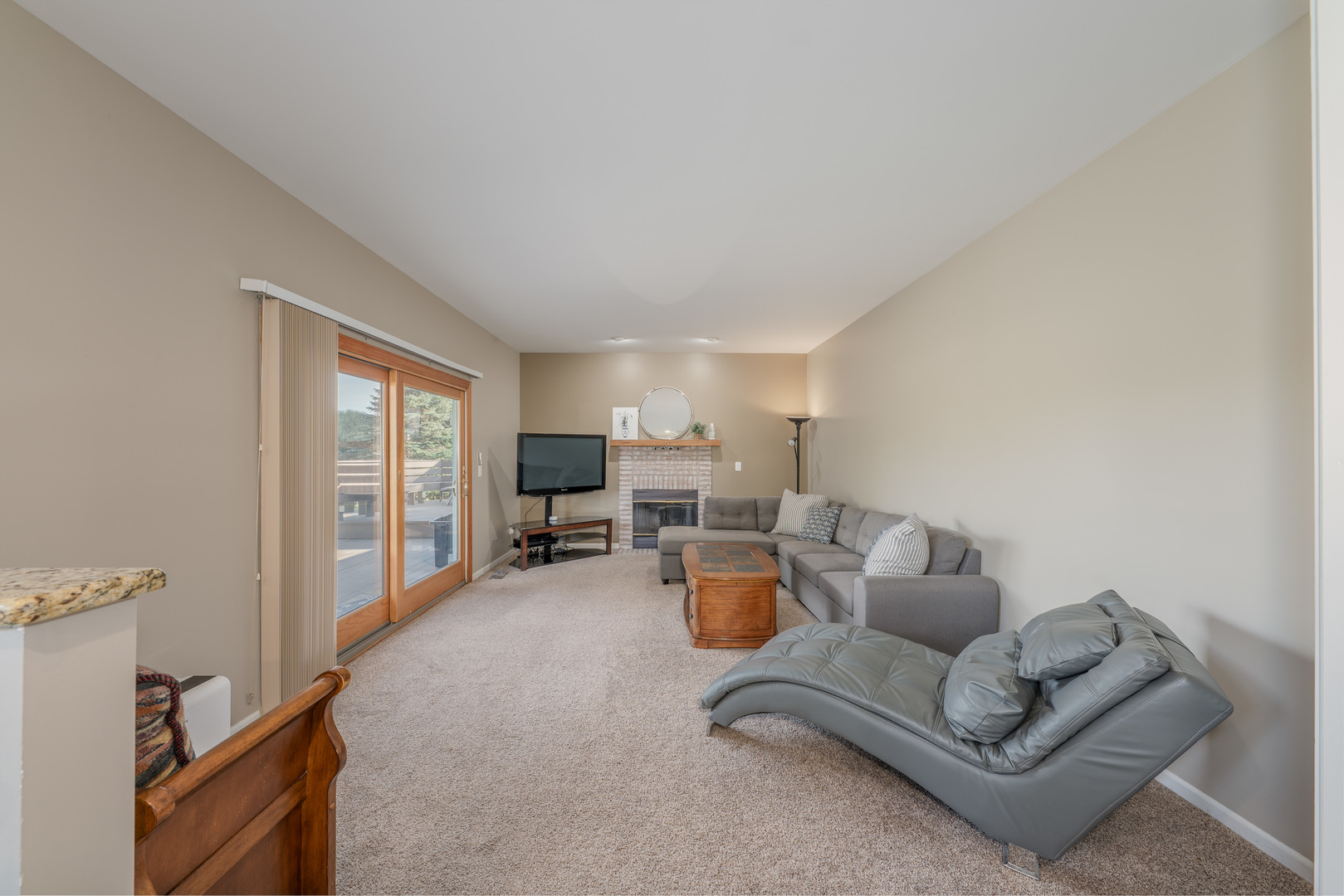 113 Bittersweet Lane Streamwood, IL 60107 - Photo 8 of 24 a living room with furniture and a window