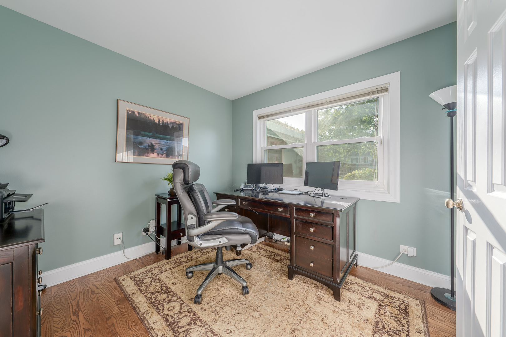 113 Bittersweet Lane Streamwood, IL 60107 - Photo 10 of 24 a view of a workspace with furniture and a window