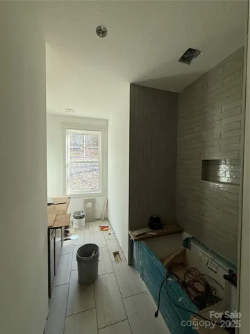 a view of a yard with snow on the road