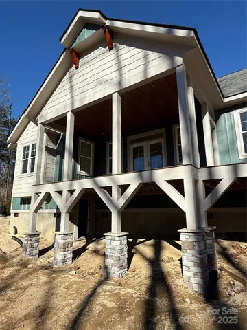 a backyard of a house with barbeque oven and table top