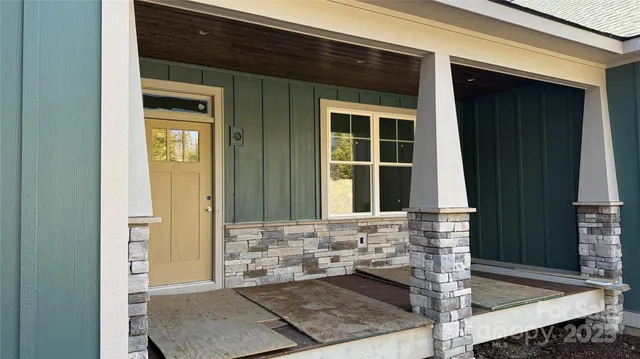 a kitchen with a refrigerator sink and cabinets
