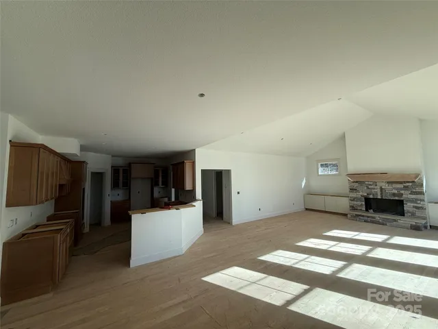 a living room with a couch and a refrigerator