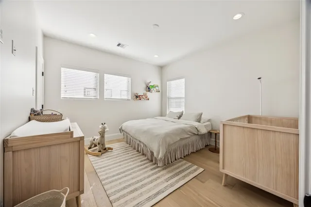 a bedroom with a bed and a table