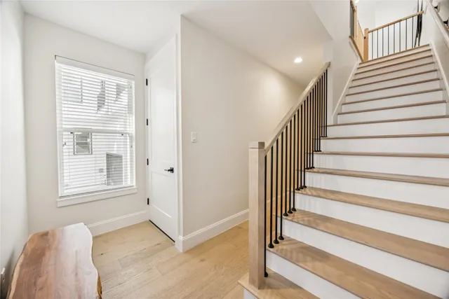 a view of entryway with wooden floor and stairs