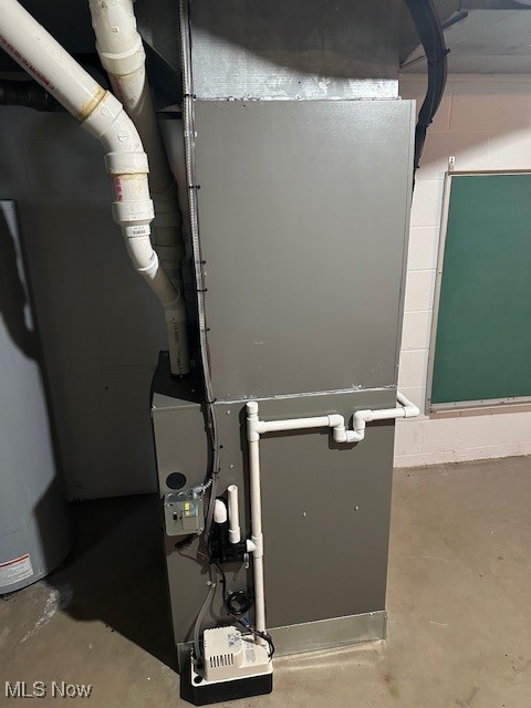1975 Warner Road Southeast Hubbard, OH 44425 - Photo 22 of 23 Utilities featuring water heater and heating unit