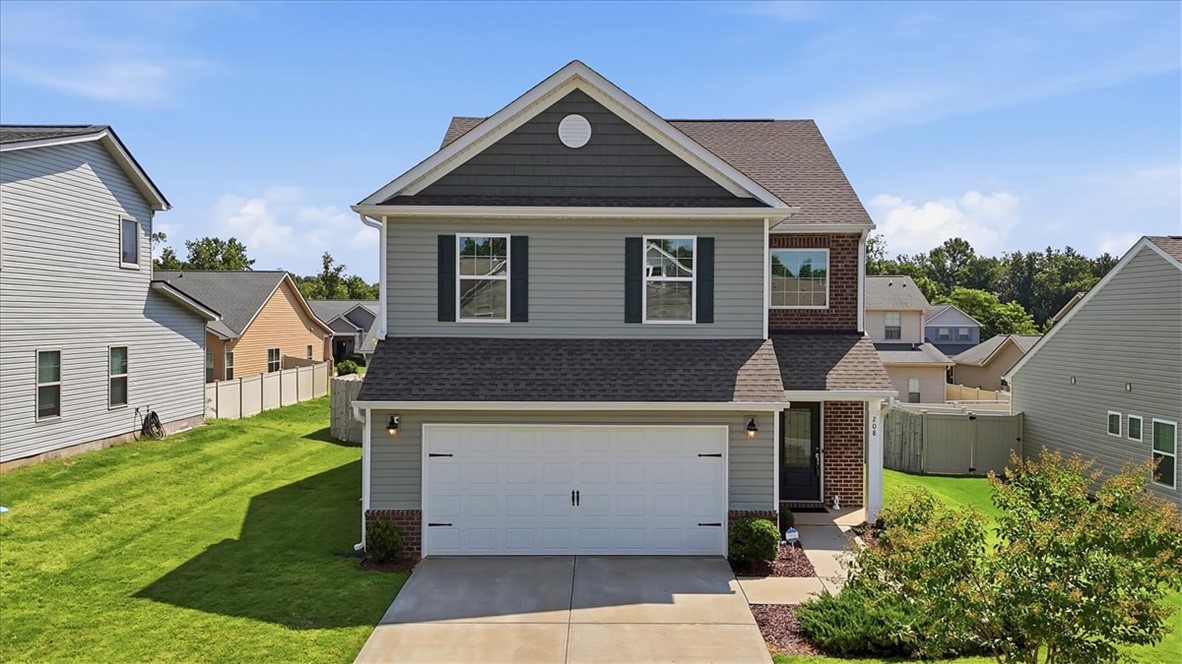 208 Grassy Creek Way Pendleton, SC 29670 - Photo 1 of 43 A classic two-story home with a neat driveway, verdant lawn, and a welcoming entry.
