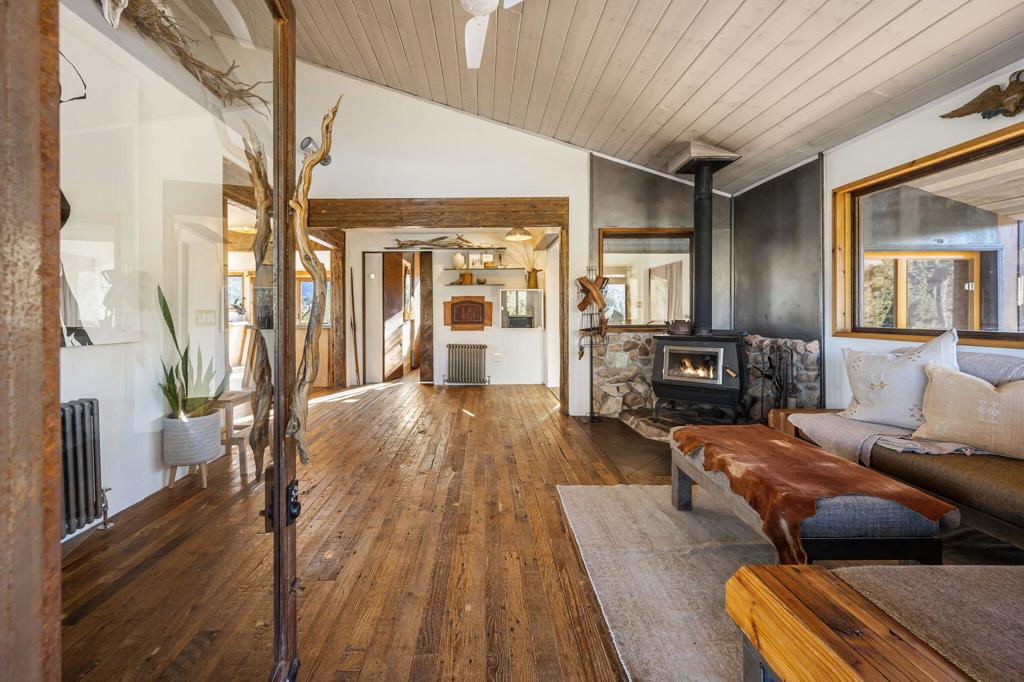 1102 Burlington Road Pioneertown, CA 92268 - Photo 14 of 68 a living room with furniture and a wooden floor