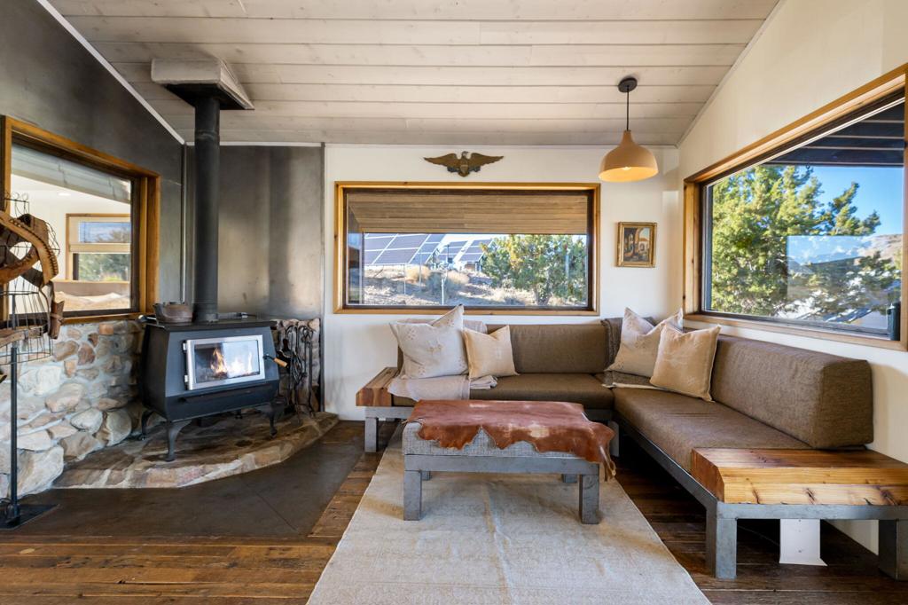 1102 Burlington Road Pioneertown, CA 92268 - Photo 16 of 68 a living room with furniture and a large window