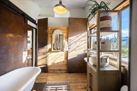 a view of outdoor space with wooden floor and stairs