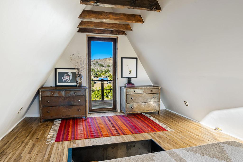1102 Burlington Road Pioneertown, CA 92268 - Photo 46 of 68 a room with a bed and a dresser