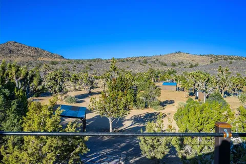 a view of a town with mountains in the background