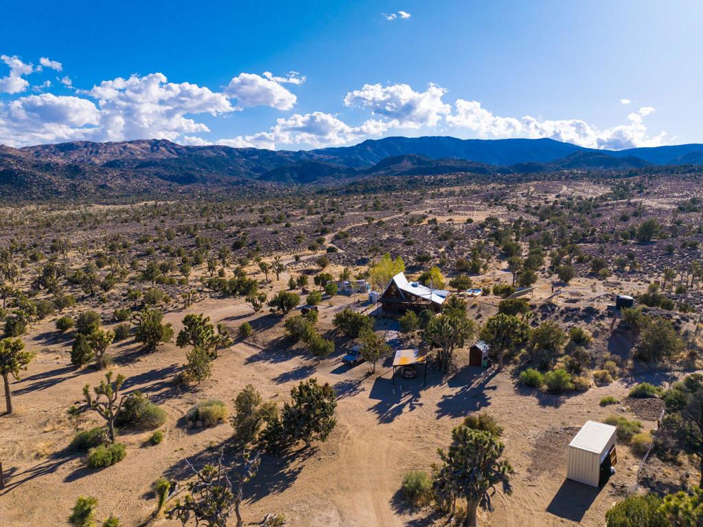 1102 Burlington Road Pioneertown, CA 92268 - Photo 8 of 68 an aerial view of a houses and a yard