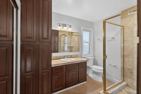 a spacious bathroom with a double vanity sink and a mirror