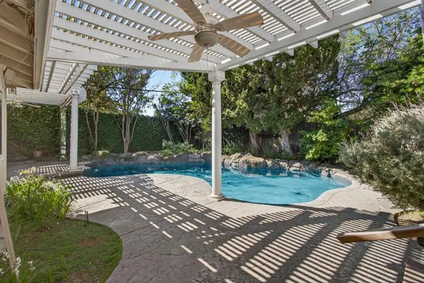 a view of a couches in patio of back yard